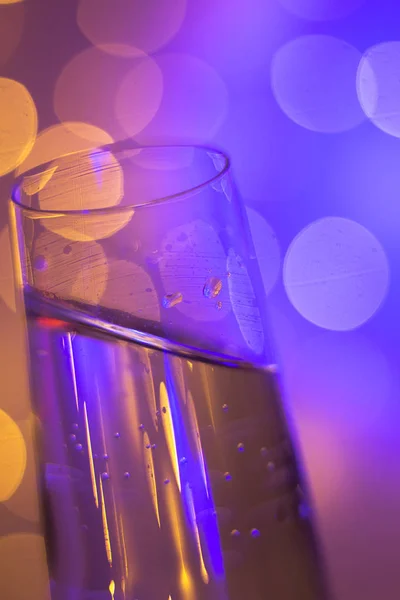 Champagne glass in disco party bar — Stock Photo, Image