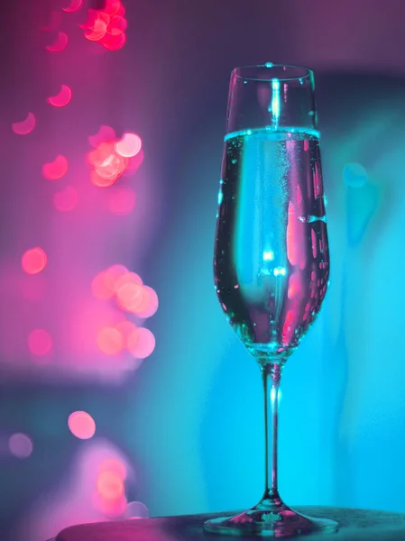 Champagne glass in disco party bar — Stock Photo, Image