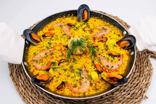 Pot with yellow rice and sea food — Stock Photo, Image