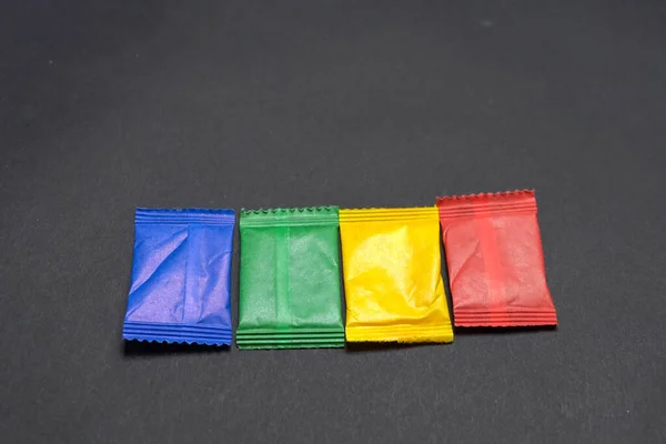 Multicolored paper bags with paint on gray table. — Stock Photo, Image