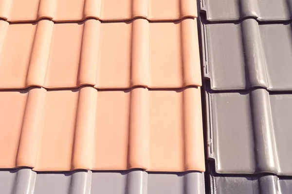Samples of ceramic roofing tiles in a warehouse of a roofing mat