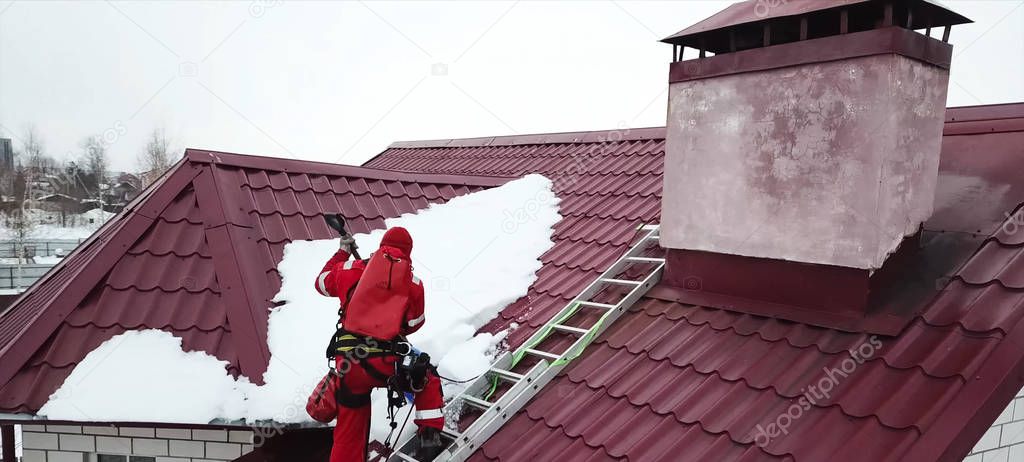 Worker does the installation of the roof of house. Installation