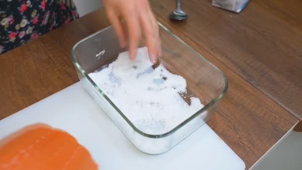 Salting salmon, Pieces of red salmon fish fillet. Red fish salinizing a piece of salmon. — Stock Footage Salting Salmon Pieces Red Salmon Fish Fillet Red Fish Salinizing Royalty Free Stock Video