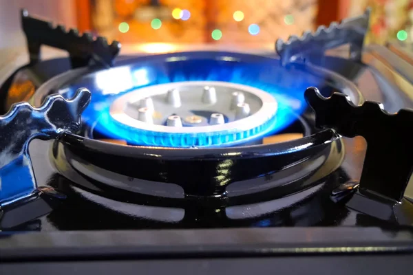 Burning gas stove. Blue flame of gas burner.