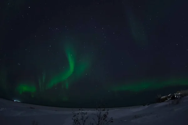 Aurora borealis in night northern sky. Ionization of air particles in the upper atmosphere. — Stock Photo, Image