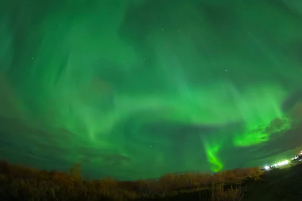 Aurora borealis in night northern sky. Ionization of air particles in the upper atmosphere. — Stock Photo, Image
