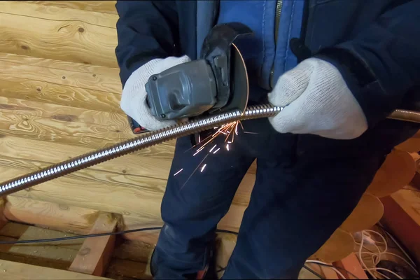 Sawing grinder of a protective casing for electrical wiring — Stock Photo, Image