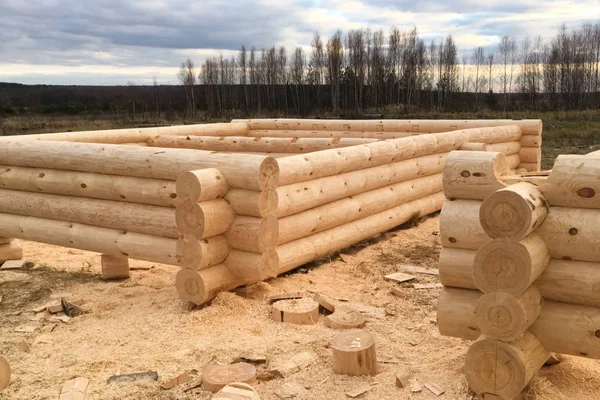 Drying and assembly of wooden log house at a construction base. — ストック写真