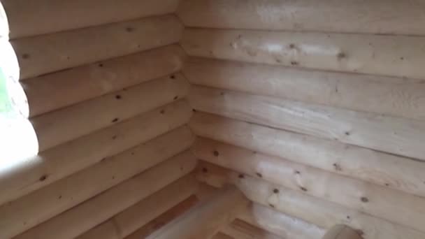 Inner part of the structure of the wooden house, details of the wooden structure under construction, the house is made of log house. — Stock Video