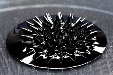 Beautiful forms of ferromagnetic fluid. Iron dissolved in a liqu clipart