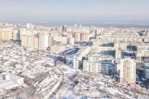 Winter city, high-rise residential development, frost in the city.