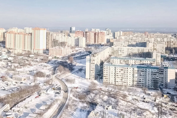 Winter city, high-rise residential development, frost in the city.