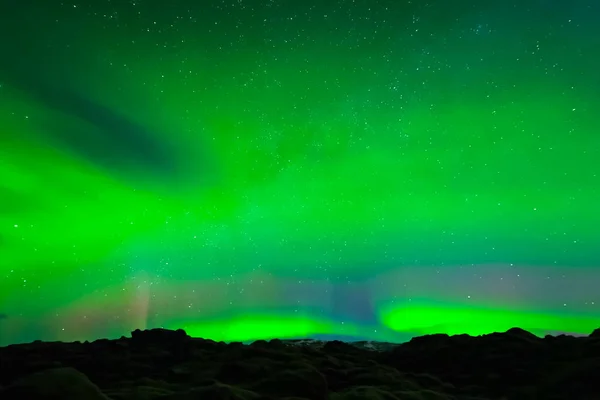 Aurora borealis in night northern sky. Ionization of air particl — 스톡 사진