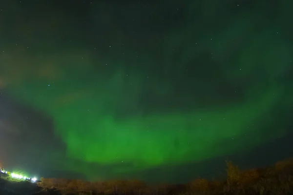 Aurora borealis in night northern sky. Ionization of air particl — Stock Photo, Image