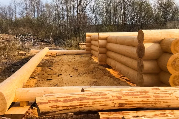 Drying and assembly of wooden log house at a construction base. — ストック写真