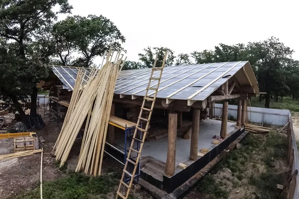 Stage of construction of a wooden house.