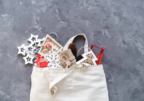 Zero waste christmas. Cotton bag with Christmas tree decor and gifts.