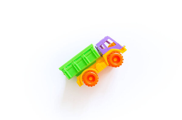 Toy plastic car. Boy game. Bright color. Montessori system.