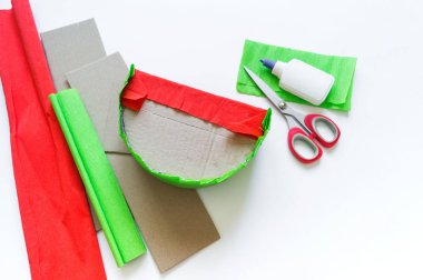 Craft diy pinata from paper and cardboard watermelon.