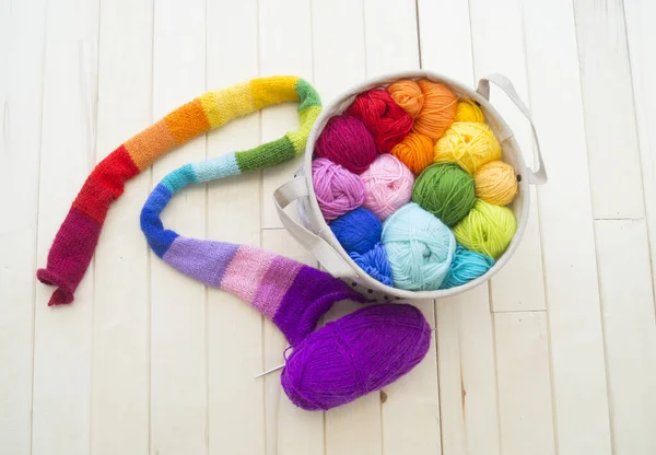 Yarn for knitting rainbow. Wood background. — Stok fotoğraf