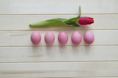 Easter holiday tulips and pink eggs.