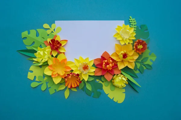 Flowers made of paper. Blue background.