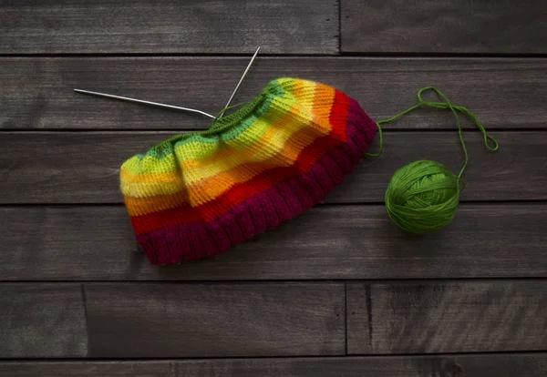 Yarn for knitting rainbow. Wood background. — Stock Photo, Image