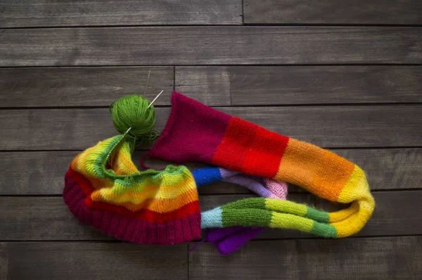 Yarn for knitting rainbow. Wood background. — Stock Photo, Image