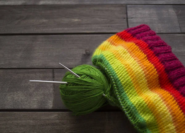 Yarn for knitting rainbow. Wood background. — Stock Photo, Image