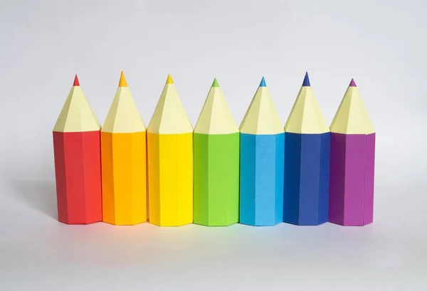 Pencil made of paper. The color of the rainbow. Back to school. Decor for the holiday.