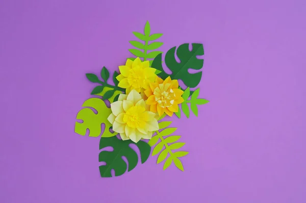 Paper craft Flower Decoration Concept. Flowers and leaves made of paper. Tropics. Pink background.