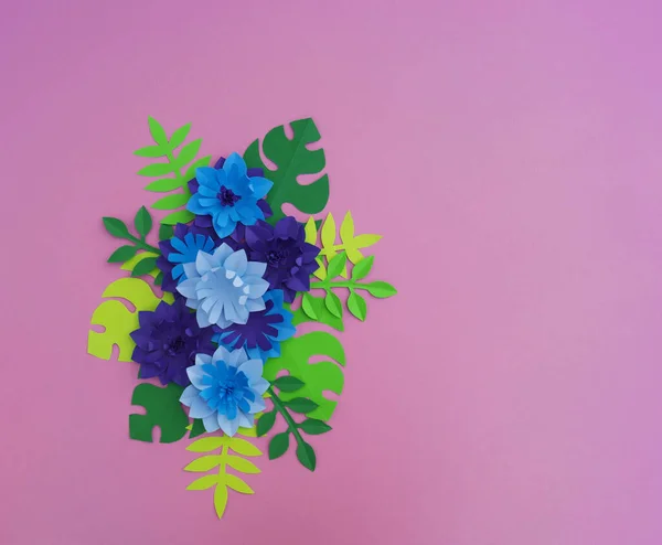 Paper craft Flower Decoration Concept. Flowers and leaves made of paper. Tropics. Pink background.