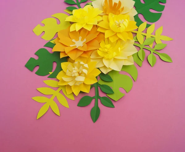 Paper craft Flower Decoration Concept. Flowers and leaves made of paper. Tropics. Pink background.
