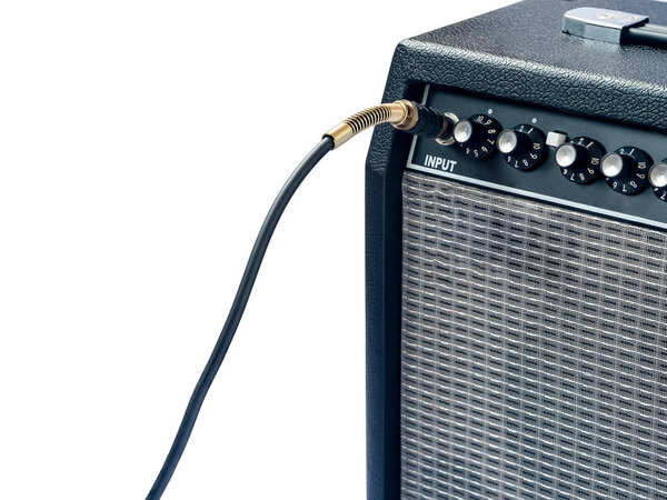 guitar amplifier with jack cable isolated on white background