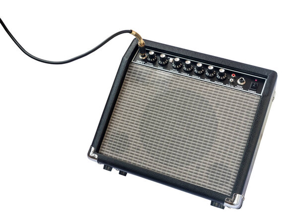 Guitar amplifier with jack cable isolated on white background