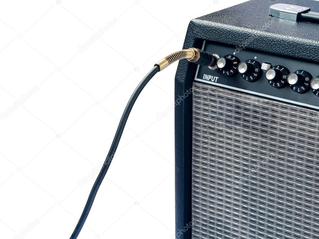 guitar amplifier with jack cable isolated on white background