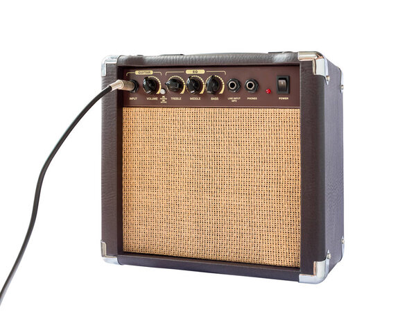 Small acoustic guitar amplifier with cable isolated on white background