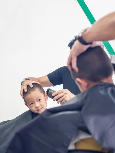 Asian boy  at the barber shop to cut the hair, vintage style — Stock Photo, Image