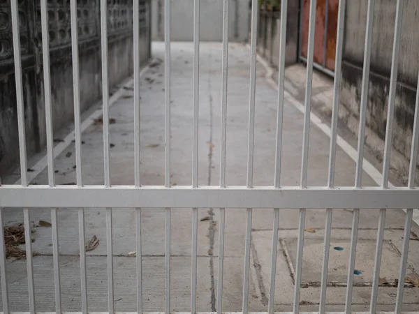 White wrought fence to property , road line, outside — Stock Photo, Image