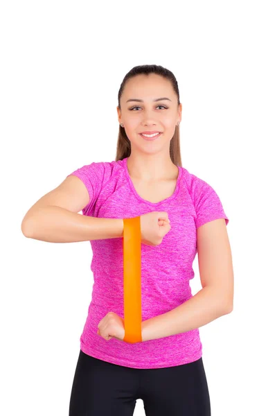 Sportovní holka s gymnastické gumovým páskem na ruce. — Stock fotografie