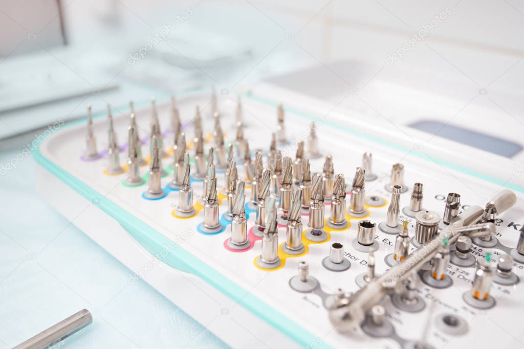 A set of tools for dental implantation. Drills, extenders and wrenches for implant installation.