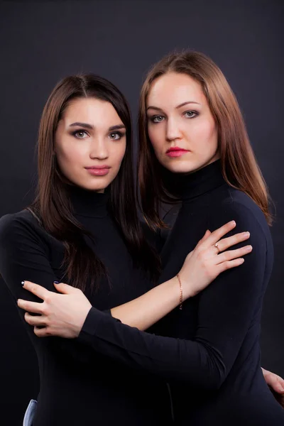 Two Young Girlfriends Standing Together Both Black Clothes Looking Camera — Stock Photo, Image