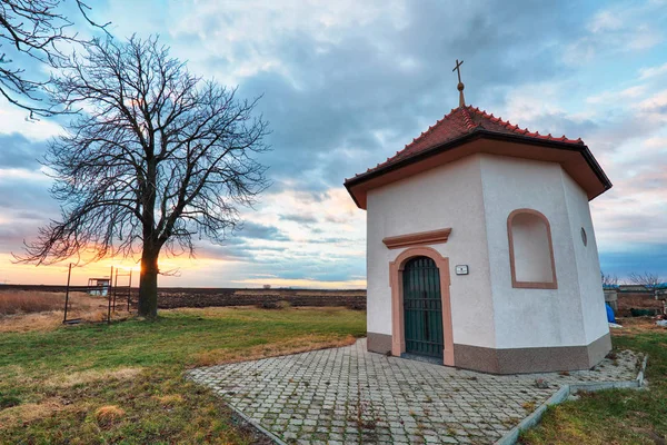 Chapel at sunset landcape with tree — Stock Photo, Image