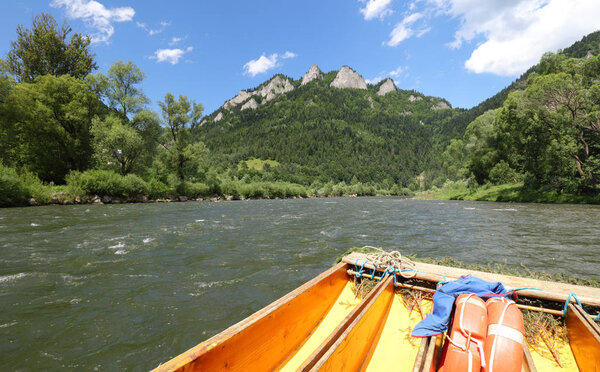 Rafting on the polish river on a Three Crowns background