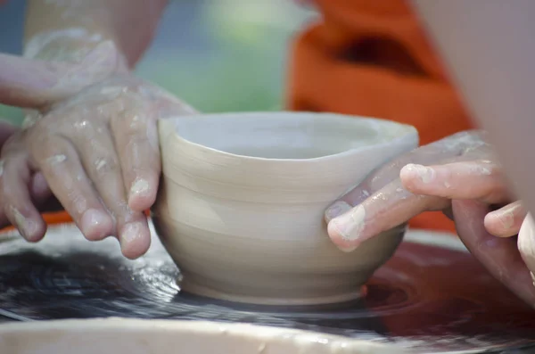 Potter during the process of making dish — Stock Photo, Image
