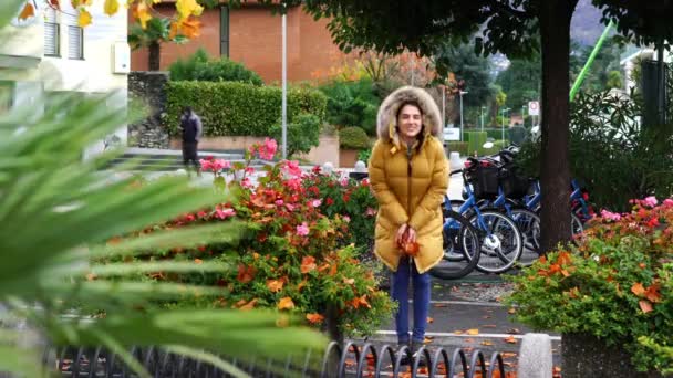 Woman tossing foliage in Ascona — Stock Video