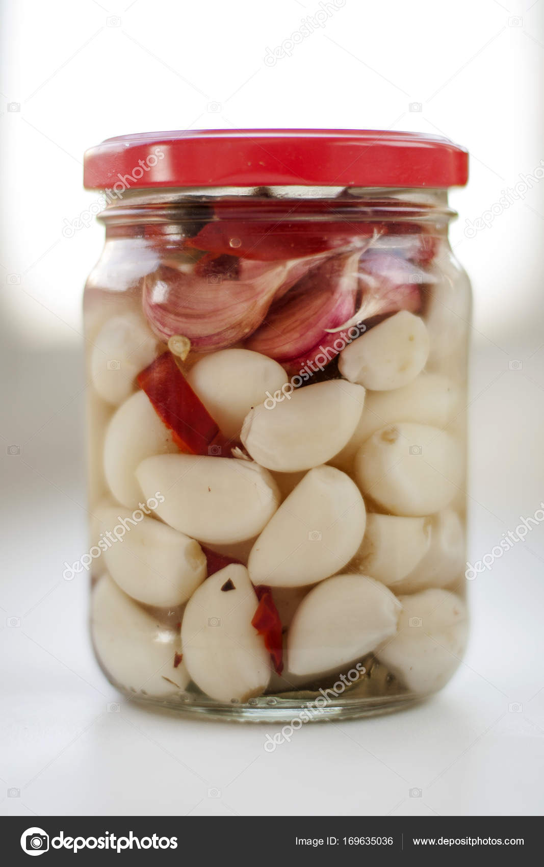 Marinated garlic cloves — Stock Photo © nechipas 169635036