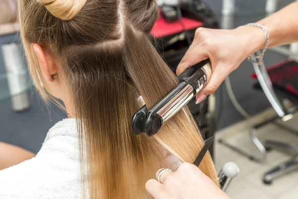 Close Hairdresser Straightening Long Brown Hair Hair Irons — Stock Photo, Image