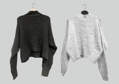 Female Flecked knit sweater with long sleeves on a hanger isolated on gray background. Autumn and winter clothes. Composition of clothes. Flat lay, top view, copy space. Winter clothes pattern
