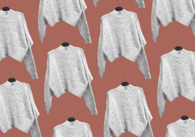 White Female Flecked knit sweater with long sleeves on a hanger isolated on red background. Autumn and winter clothes. Composition of clothes. Flat lay, top view, copy space. Winter clothes pattern